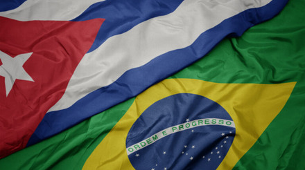 waving colorful flag of brazil and national flag of cuba. macro
