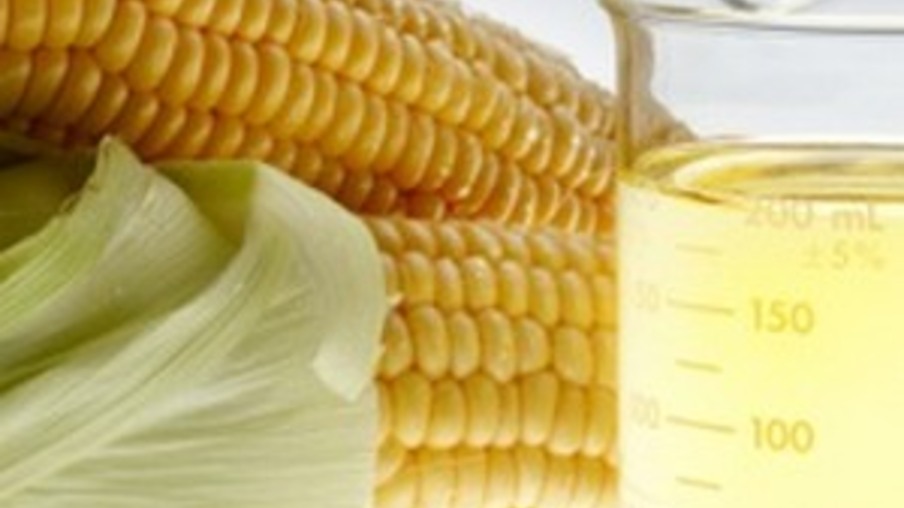 Beaker of of ethanol and ears of corn shot on lightbox