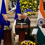 European Commission President Ursula von der Leyen, left, looks on as Indian Prime Minister Narendra Modi, center, and European Council President Antonio Costa greet each other after reaching free trade agreement between India and EU in New Delhi, India, Tuesday, Jan. 27, 2026. (AP Photo/Manish Swarup)