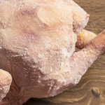 Frozen chicken from the refrigerator closeup