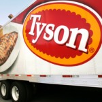 In this photo made Wednesday, Oct. 28, 2009, a Tyson Foods, Inc., truck is parked at a food warehouse in Little Rock, Ark. Tyson Foods, the world's largest meat producer, said Monday, Nov. 23, 2009, it lost money in its fiscal fourth quarter primarily on a hefty goodwill impairment charge.(AP Photo/Danny Johnston)
